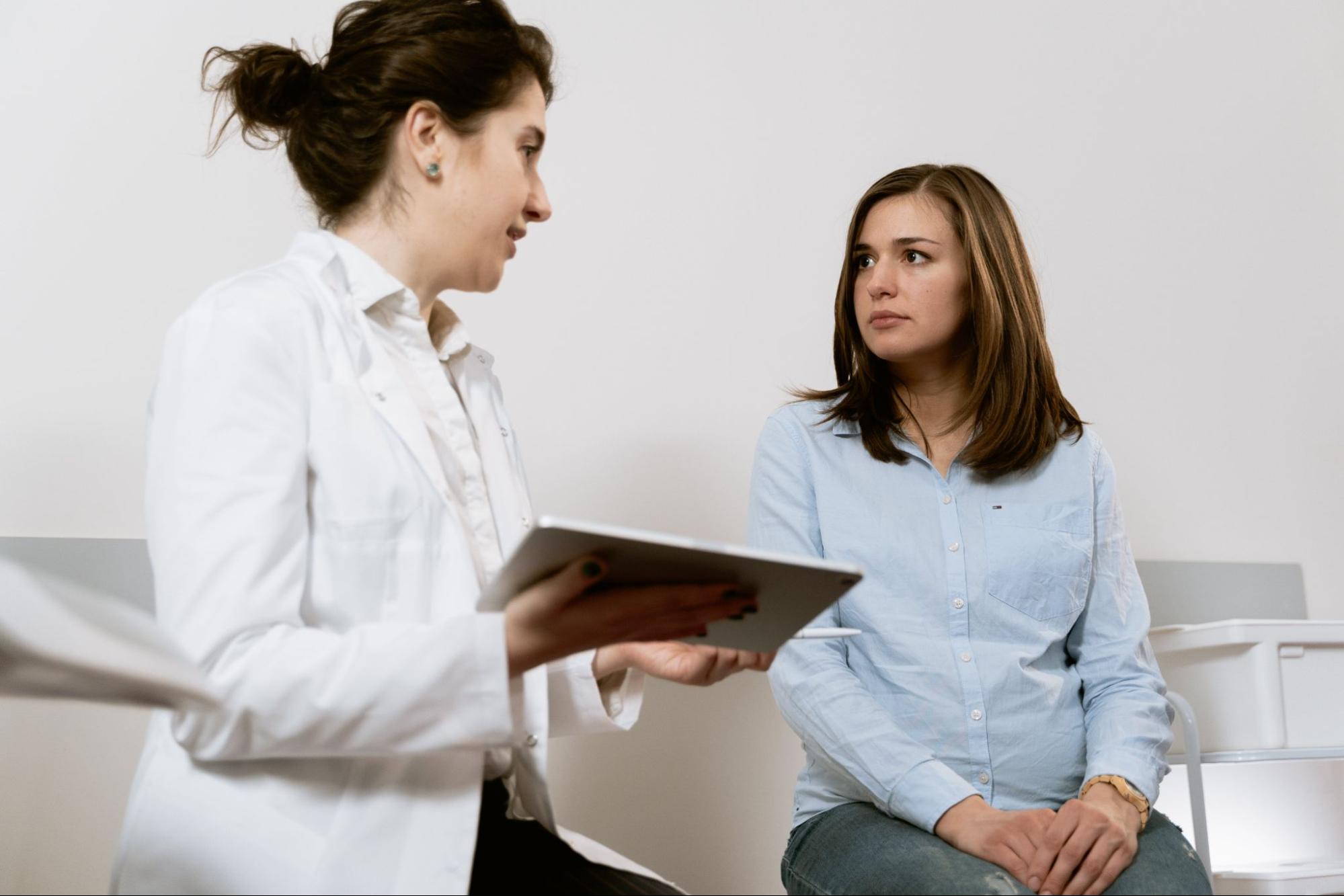 Doctor assisting patient